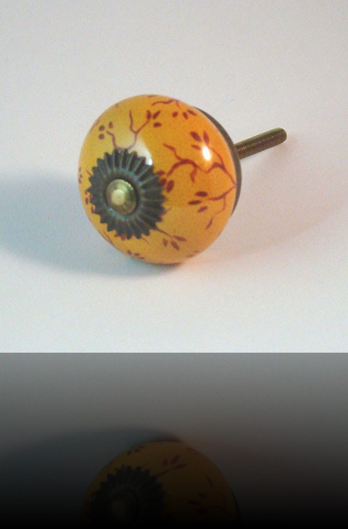 bouton de tiroir rond orange et feuillage